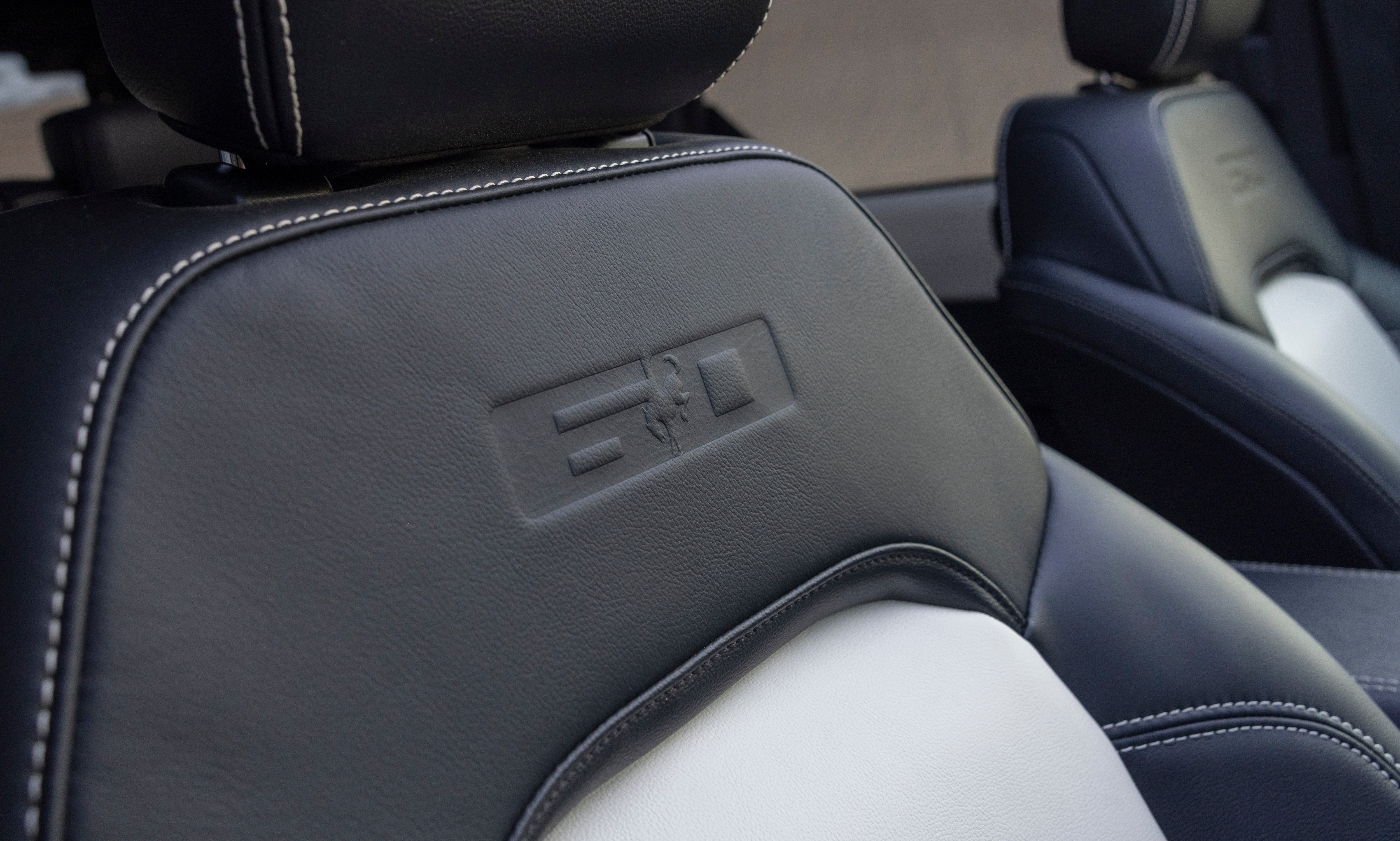 2026 Ford Bronco 60th Anniversary Package detail shot of interior. Seat shown with "60" anniversary logo, with the Bronco in the middle of the 6 and 0, on the top of the front seat.